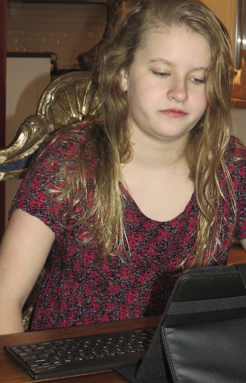 Emma getting ready to write